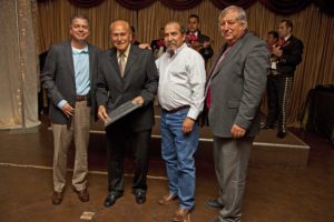Mission City Manager Martin Garza, Mission Parks and Rec Director Julian Gonzalez, and Mission City Councilman Dr. Armando O'cana congratulate the owner of Mission Auto Electric.
